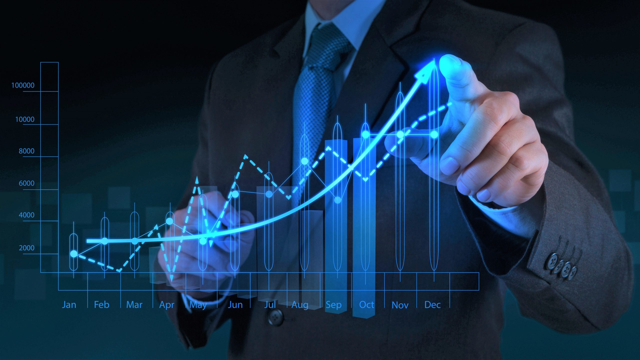 businessman-in-suit-pointing-at-holographic-financial-growth-chart